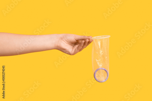 Female hand with open condo...
