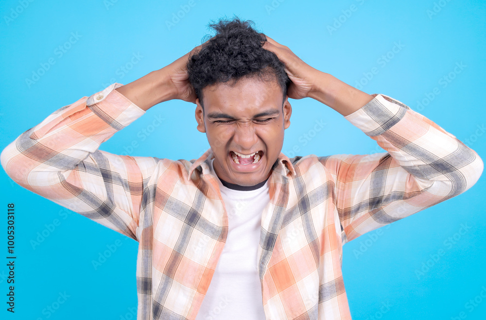 Dizzy Young Asian Man Confused With Touching his Head Clothes Isolated on Blue Background Dizzy Young Asian Man Confused With Touching his Head Clothes Isolated on Blue Background
