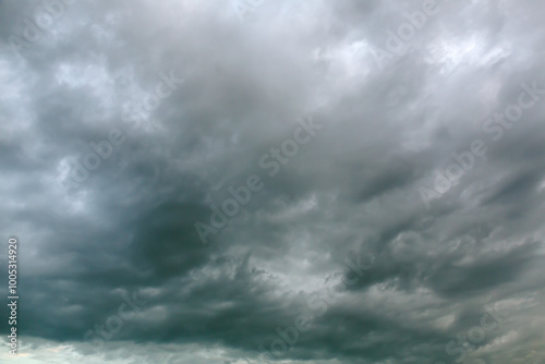 dramatic dark overcast sky with rainy clouds before thunder-storm.