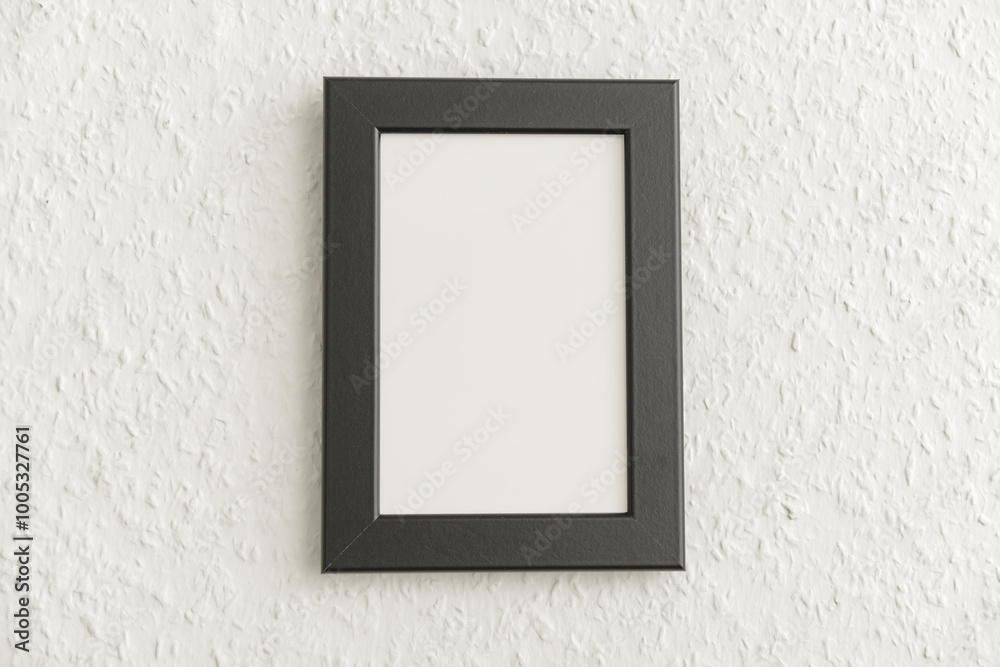 Black photo frame on light wall Black photo frame on light wall