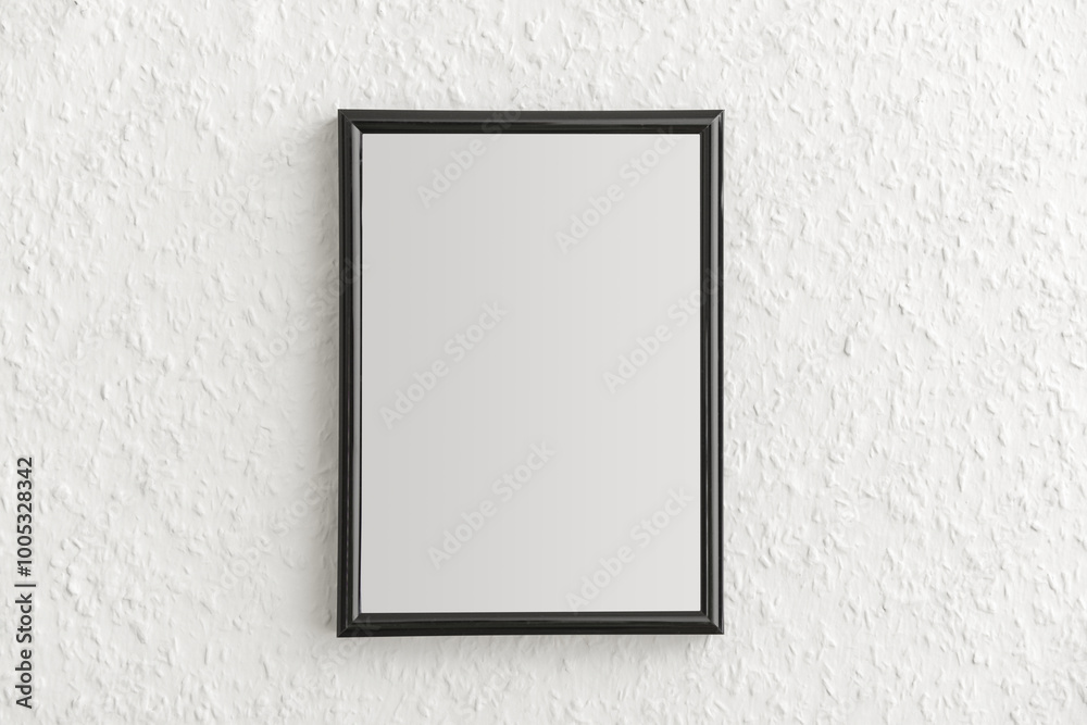 Black photo frame on light wall Black photo frame on light wall