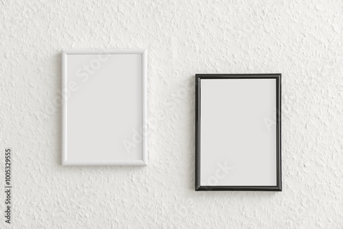 Photo frames on light wall