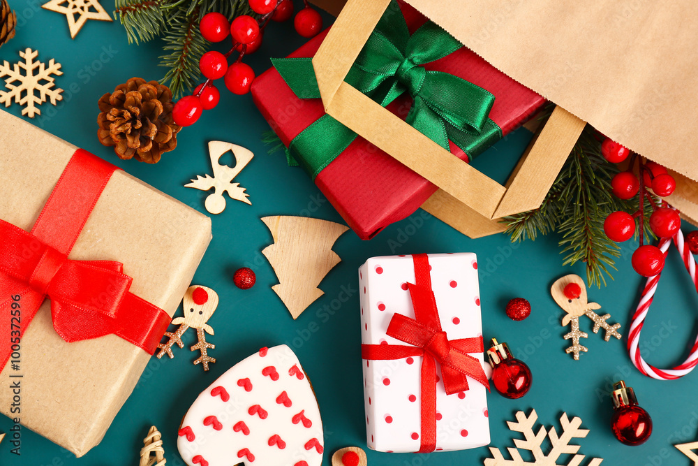 Obraz premium Beautiful composition with gifts, paper bag and gingerbread on blue background, closeup