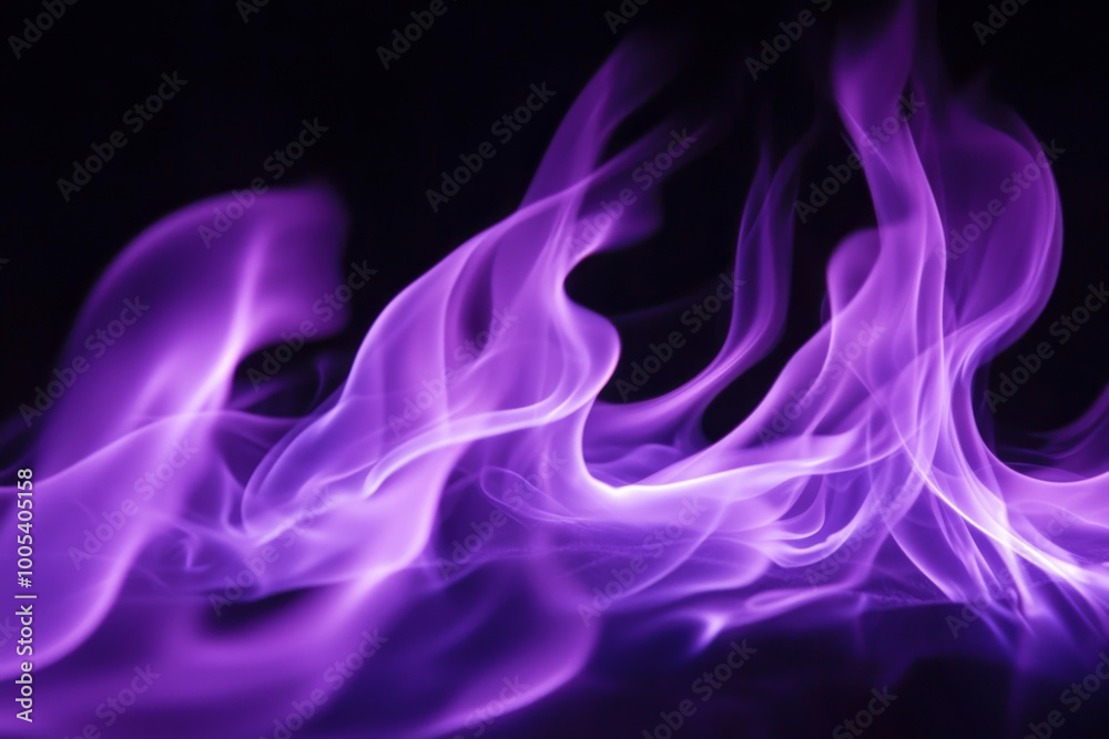 Obraz premium A mesmerizing display of purple flames, swirling and dancing against a dark backdrop, evoking a sense of mystery and energy.