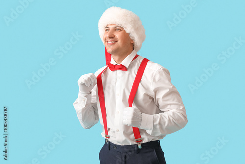 Young Santa Claus on blue b...