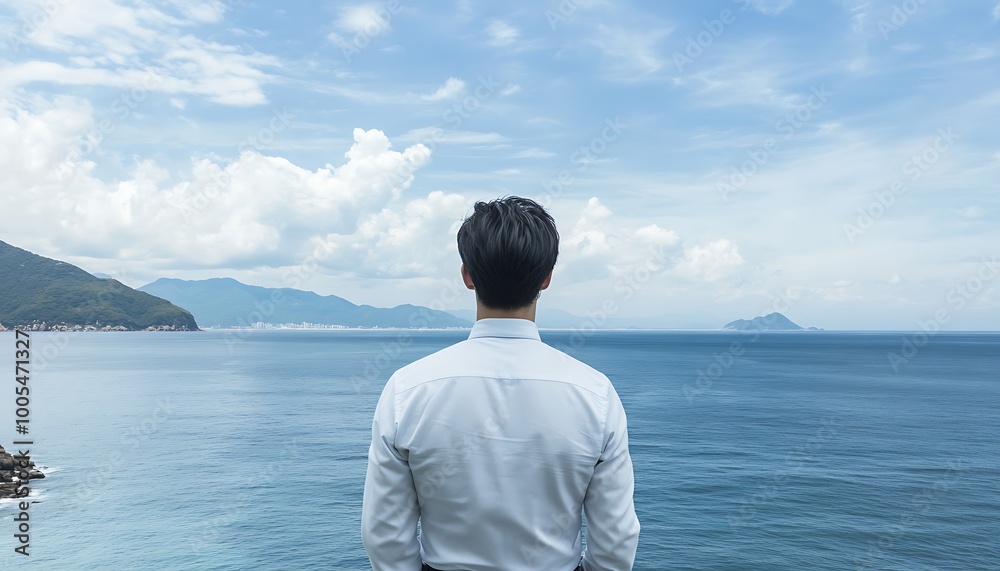 Man Gazing at the Expansive Ocean Man Gazing at the Expansive Ocean