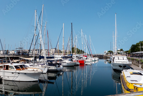 A large number of boats are docked at a marina