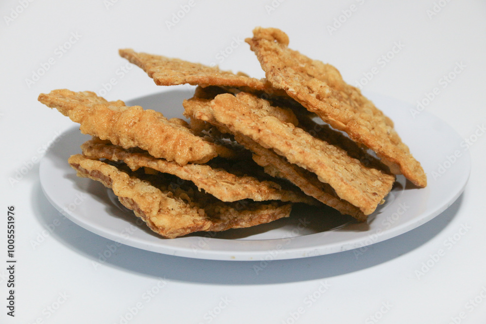 tempe or keripik tempe or kripik tempe. tempeh chips a typical Indonesian food made from soybeans and thinly sliced tempe or keripik tempe or kripik tempe. tempeh chips a typical Indonesian food made from soybeans and thinly sliced