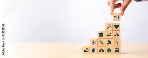 Health insurance concept. healthcare medical wooden cube block with icon, health and access to welfare health concept