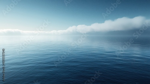 Serene morning at the tranquil ocean with soft clouds above the horizon and gentle waves lapping at the water's surface