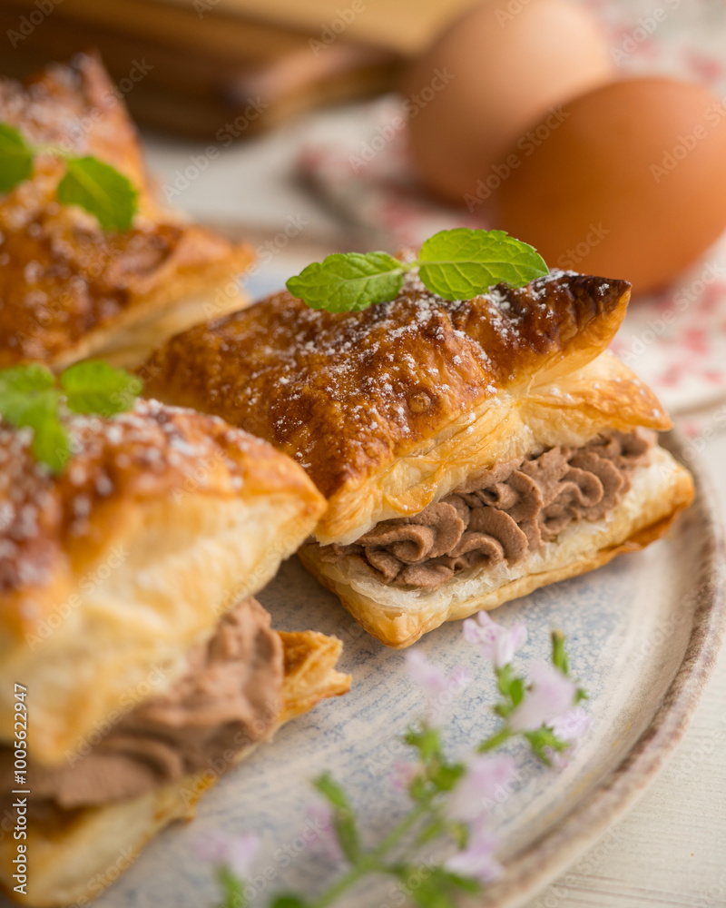 Miguelitos with chocolate truffle cream. Spanish chocolate puff pastry dessert Miguelitos with chocolate truffle cream. Spanish chocolate puff pastry dessert