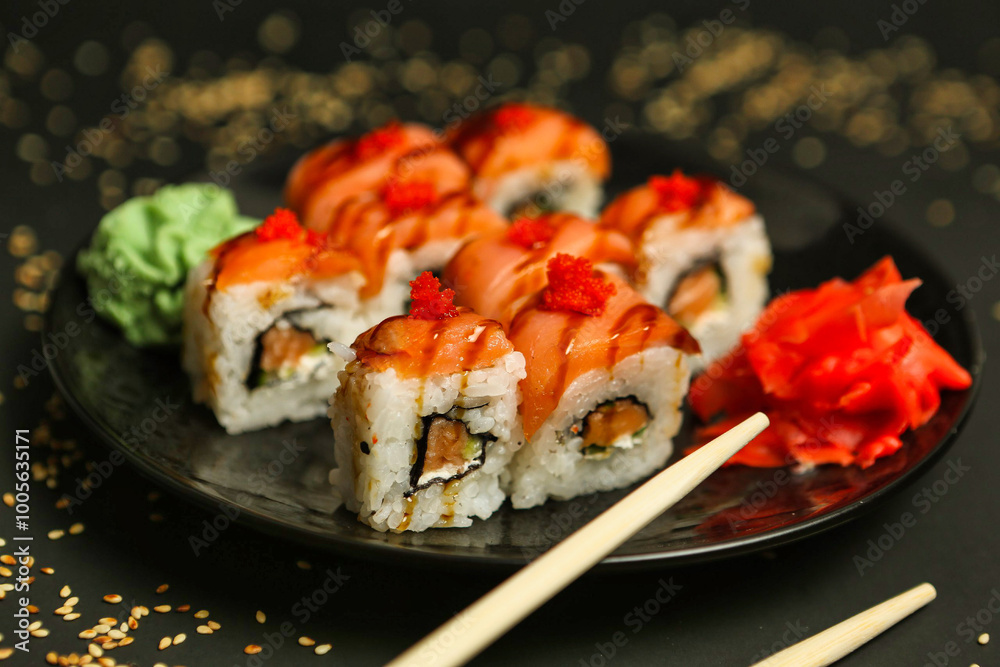 Salmon Sushi Rolls on a Black Plate Salmon Sushi Rolls on a Black Plate