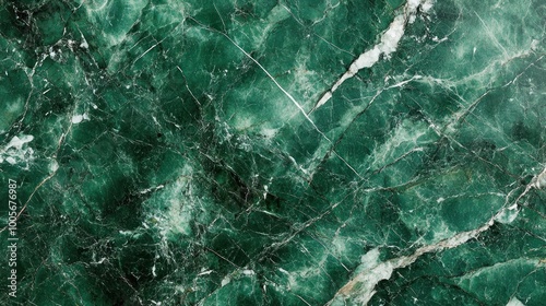 A close-up view of textured green marble with white veining.