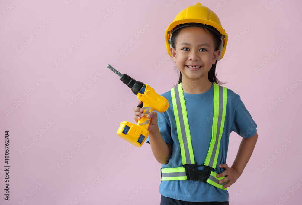 Little handyman with tools Cute child is a construction worker playing with a screwdriver, hammer, drill, construction equipment, and engineering, the dream job of a young Asian girl in the future. Little handyman with tools Cute child is a construction worker playing with a screwdriver, hammer, drill, construction equipment, and engineering, the dream job of a young Asian girl in the future.