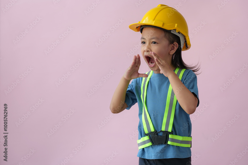 Young child and education concept smiling, a little girl in yellow hat making gestures shouting. Communication. Work planning. Architecture, construction project. Future career engineer. Young child and education concept smiling, a little girl in yellow hat making gestures shouting. Communication. Work planning. Architecture, construction project. Future career engineer.