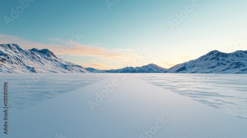 Snow-covered valley with mountains under a clear sky during sunset.
