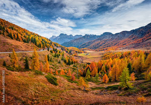 Spectacular autumn view of Valles valley. Unbelievable colors of Dolomite Alps with jagged peaks, rolling meadows, pastures and streams. Fantastic morning scene of Italian countryside.