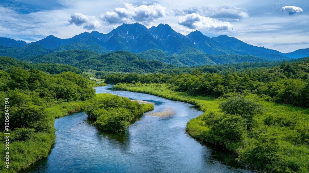 Stunning view of the Azusa River winding through the lush greenery of KamikAchi, with the Hotaka Mountains towering in the background, creating a serene and scenic landscape. Stunning view of the Azusa River winding through the lush greenery of KamikAchi, with the Hotaka Mountains towering in the background, creating a serene and scenic landscape.