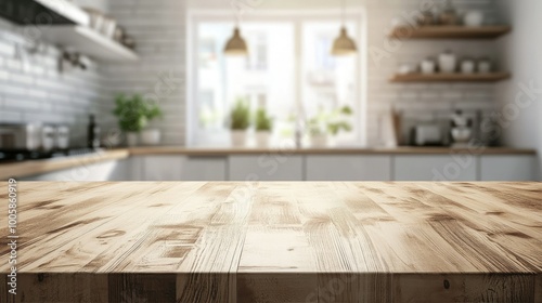 Wooden kitchen table top with a blurred white, modern kitchen in the background. Bokeh effect creates a clean and bright setting, ideal for displaying products.