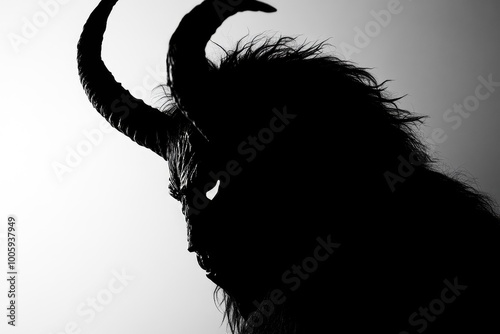 Detail in silhouette of a krampus mask - generative ai photo