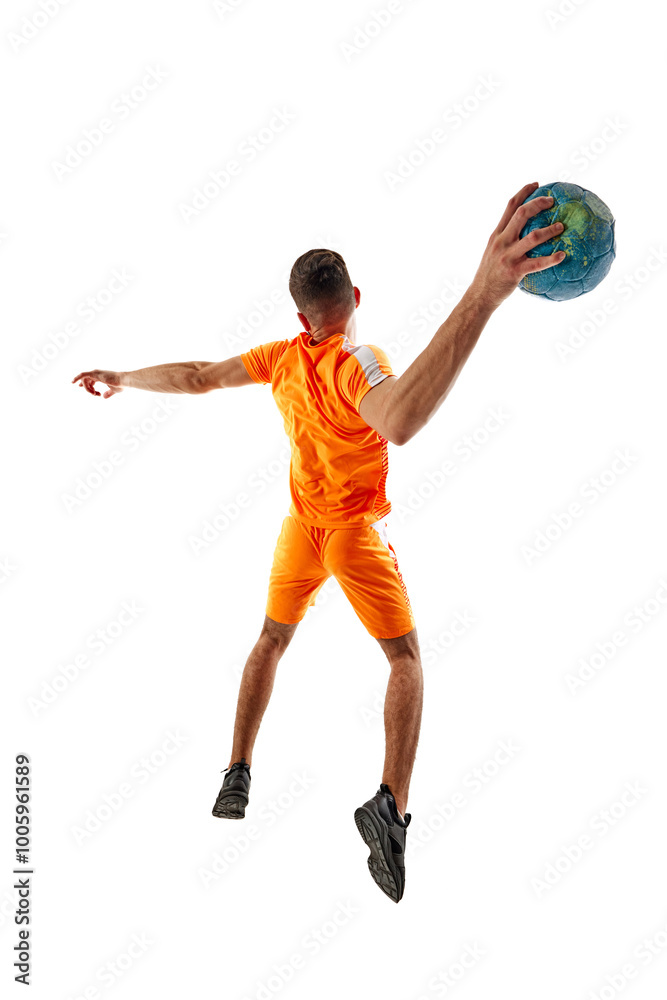 Young athletic woman, handball player in orange uniform in motion, throwing ball, playing isolated on white background. Concept of sport, active and healthy lifestyle, hobby