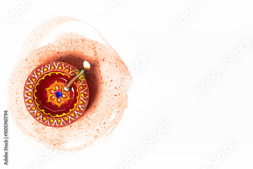 Happy Diwali - Close up of diwali diya lamp on white background with space for text. Hindu festival of lights.