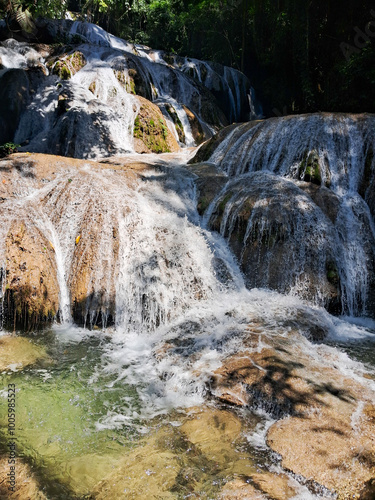 Saluopa Waterfall: Located in the Heart of the Forest of Central Sulawesi, Featuring 12 Stunning and Crystal Clear Waterfalls. The waterfall is a favorite and is always sought after by foreign tourist photo