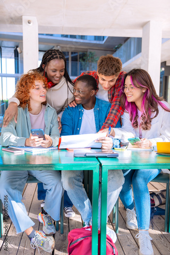 Happy diverse group of students studying in the library.Vertical