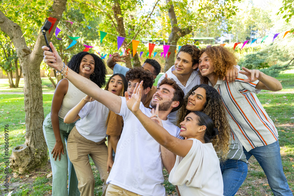 Group of friends taking selfie in park with colorful flags Group of friends taking selfie in park with colorful flags