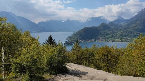 scenic panorama landscape of mountains, duingt and Annecy lake seen from roc de Chere in Talloires, Haute Savoie, hd video, still photo