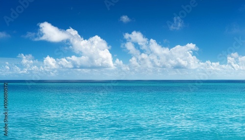 Serene Blue Sea and Sky with Puffy Clouds on a Clear Day Peaceful Oceanic Panorama Background Concept for Calm and Tranquility Searches
