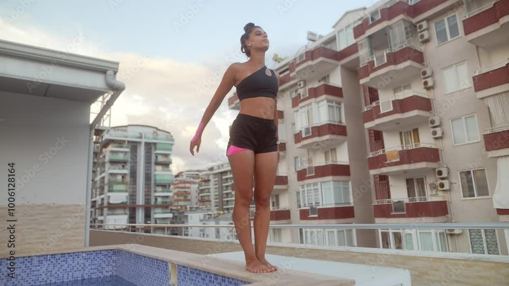 A Young Woman in a Bikini Readies Herself to Dive into a Vibrant Swimming Pool This Summer A Young Woman in a Bikini Readies Herself to Dive into a Vibrant Swimming Pool This Summer