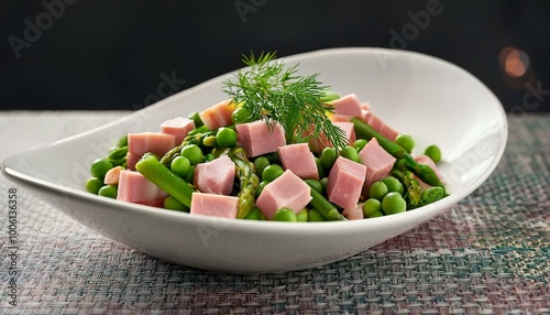 A fresh and colorful mix of diced ham, green peas, and soft asparagus, adorned with dill, served in a white bowl, exuding a feeling of lightness and crispness photo