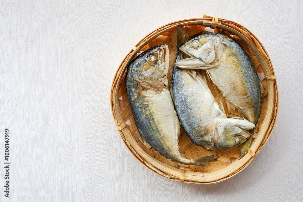 Steamed Mackerel in Mackerel basket on white background,Thai called Plathu Steamed Mackerel in Mackerel basket on white background,Thai called Plathu