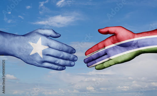 Gambia and Somalia country handshaking with flags, consensus concept international co-operation illustration