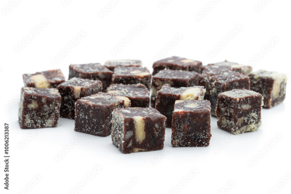 Chocolate cubes with nuts and cookies isolated on white Chocolate cubes with nuts and cookies isolated on white