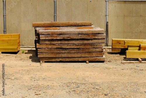 Sleepers piled up beside the tracks