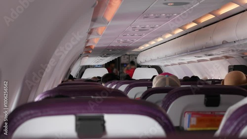 view inside airplane aircraft selective foccusing with many seats in rows in the plane cabinn of aircraft while airplane flying full with passenger.travelling vacation holiday transportation photo