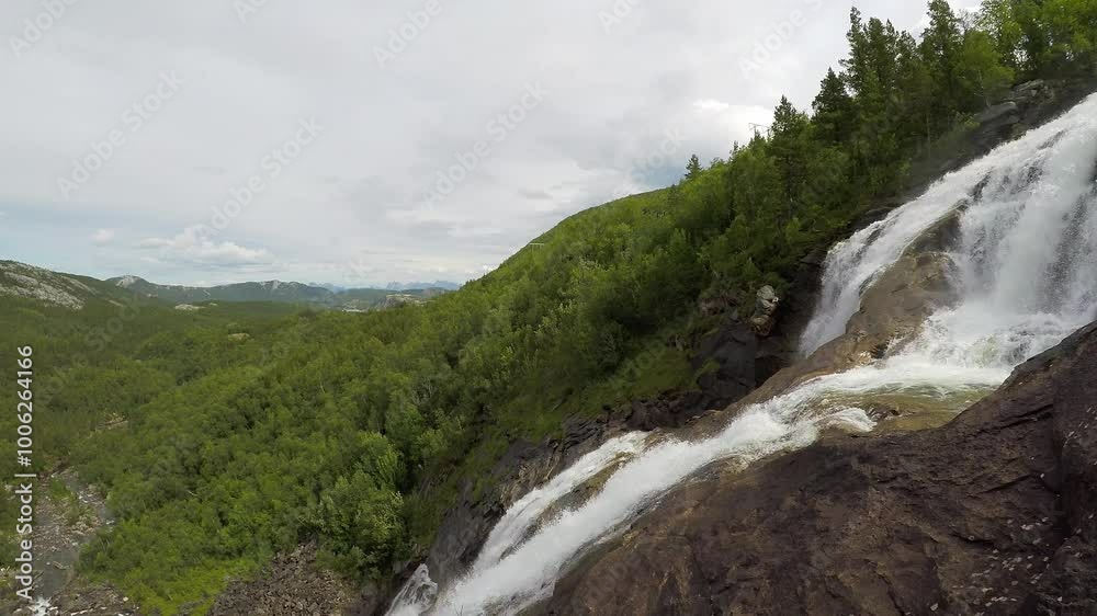The Valnesfossen waterfall in the region of Bodø, Norway The Valnesfossen waterfall in the region of Bodø, Norway