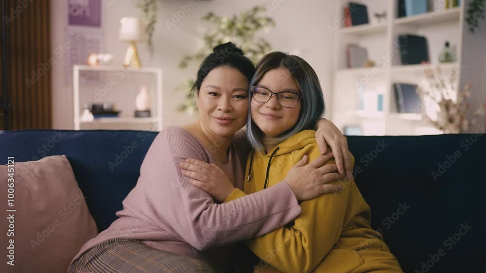 Portrait of happy Asian mom and her teen daughter hugging and smiling, family Portrait of happy Asian mom and her teen daughter hugging and smiling, family