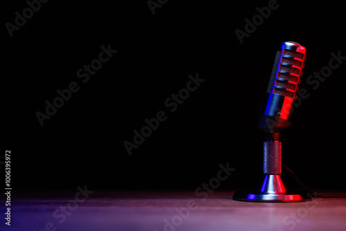 Antique microphone on black photo