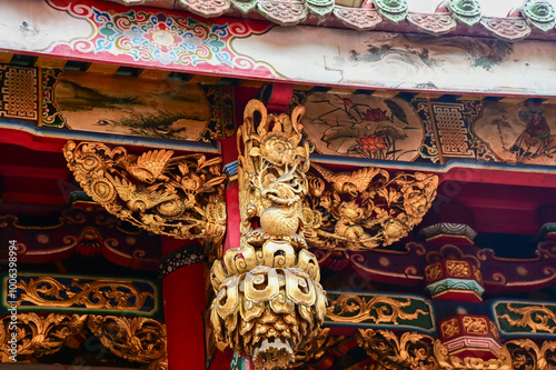 Close-up of the ornate decor on the Mengjia Longshan Temple in Taipei, Taiwan. Chinese folk religion landmark. Buddhist Temple. Religious and traditional Chinese art.  photo