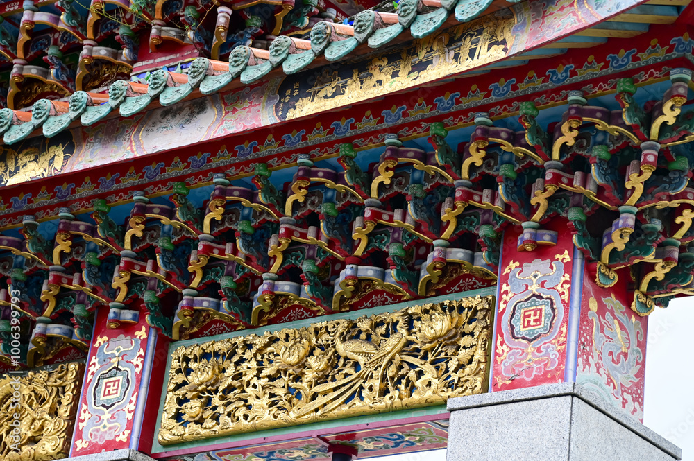 Close-up of the ornate decor on the Mengjia Longshan Temple in Taipei, Taiwan. Chinese folk religion landmark. Buddhist Temple. Religious and traditional Chinese art. Close-up of the ornate decor on the Mengjia Longshan Temple in Taipei, Taiwan. Chinese folk religion landmark. Buddhist Temple. Religious and traditional Chinese art.