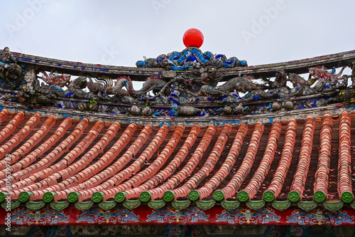 Close-up of the ornate decor on the Mengjia Longshan Temple in Taipei, Taiwan. Chinese folk religion landmark. Buddhist Temple. Religious and traditional Chinese art.  photo