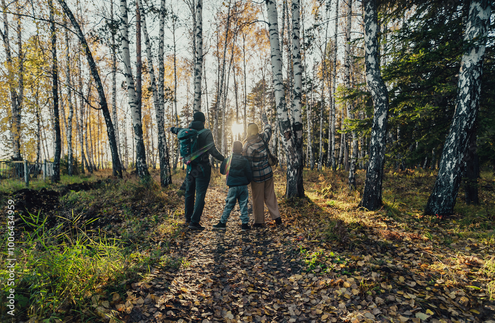 Fototapeta premium family walk in the autumn woods