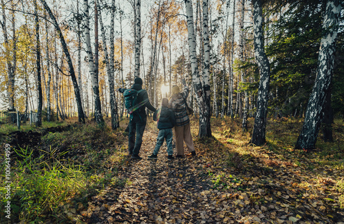 family walk in the autumn woods