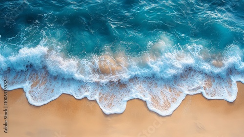 Ocean waves gently crashing on sandy beach