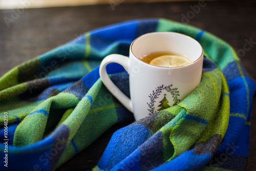 Cup of hot tea with lemon and coffin scarf.
