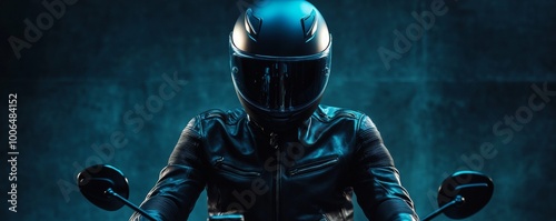 Motorcycle rider wearing helmet and leather jacket posing in studio