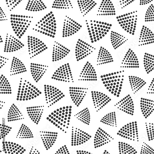 Triangular shapes from halftone dots grouped in vector seamless pattern. Subtle surface art in black and white for use in fabric or graphic design or printing on various surfaces.